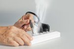 elderly-have-problem-mistake-plugging-electrical-socket-type-to-equipment-92853314.jpg