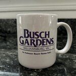 White coffee mug with Busch Gardens logo in purple text.