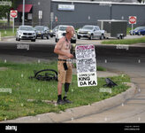 homeless-man-standing-on-a-street-corner-in-springfield-missouri-holding-a-sign-asking-for-ran...jpg