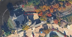 Satellite photo of the SFGAdv frontier adventures fort with the slated wall between the old Skyride station and Runaway Train outlined with a red box.